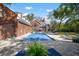 Outdoor living space with a pool, brick patio, and view of the back of the home at 2906 Pemberton Creek Dr, Seffner, FL 33584