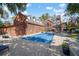 Outdoor living space with a covered pool, brick patio, and view of the back of the home at 2906 Pemberton Creek Dr, Seffner, FL 33584