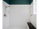 Modern shower with dual shower heads, white tile walls, and a built-in seat at 2906 Pemberton Creek Dr, Seffner, FL 33584
