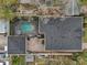 Aerial view of a private pool and backyard surrounded by patio and landscaping at 2915 W Bay View Ave, Tampa, FL 33611