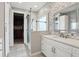 Modern bathroom with a glass-enclosed shower, white vanity, and stylish tile work at 2915 W Bay View Ave, Tampa, FL 33611
