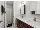 Updated bathroom with double sinks, wood cabinets, and a separate toilet and shower area at 2915 W Bay View Ave, Tampa, FL 33611