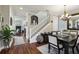 Elegant dining area with hardwood floors, staircase, and stylish decor for gatherings at 2915 W Bay View Ave, Tampa, FL 33611