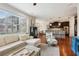 Open-concept living room flows into the kitchen, featuring hardwood floors and a large window at 2915 W Bay View Ave, Tampa, FL 33611
