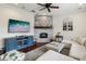 Comfortable living room featuring a whitewashed brick fireplace and stylish decor at 2915 W Bay View Ave, Tampa, FL 33611