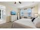 Bright bedroom featuring a walk-in shower, neutral tones and soft natural light at 2915 W Bay View Ave, Tampa, FL 33611