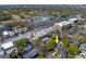 Aerial view of the property (highlighted by yellow arrow) surrounded by lush greenery at 3007 W Angeles St, Tampa, FL 33629