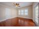 Empty bedroom with neutral walls, ceiling fan, hardwood floors, and bright natural light at 3007 W Angeles St, Tampa, FL 33629