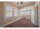 Cozy bedroom with plush carpeting, neutral walls, ceiling fan and lots of natural light at 3007 W Angeles St, Tampa, FL 33629