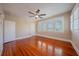Empty bedroom featuring hardwood floors, neutral walls, bright windows and ceiling fan at 3007 W Angeles St, Tampa, FL 33629