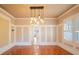 Stylish dining area with hardwood floors, wainscoting, and decorative pendant lighting at 3007 W Angeles St, Tampa, FL 33629