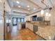 Spacious kitchen with modern appliances, granite countertops, and a stylish tile backsplash at 3007 W Angeles St, Tampa, FL 33629
