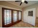View of the living room with doors leading to the pool area in this beautiful home at 3007 W Angeles St, Tampa, FL 33629
