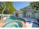 A beautiful backyard pool and spa provide a relaxing outdoor living space at 3007 W Angeles St, Tampa, FL 33629