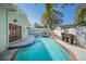 Relaxing backyard featuring a pool, spa and beautifully landscaped yard at 3007 W Angeles St, Tampa, FL 33629