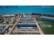 Expansive aerial view of a waterfront condo community with beach access and boat docks at 3010 59Th S St # 314, Gulfport, FL 33707
