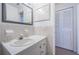 Bathroom with a vanity, decorative backsplash, and closet at 3010 59Th S St # 314, Gulfport, FL 33707