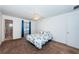 Serene bedroom with a blue and white floral bedspread, carpeted flooring, and a ceiling fan at 3010 59Th S St # 314, Gulfport, FL 33707