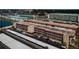 Aerial view of a multi-story condo building with ample parking and waterfront views at 3010 59Th S St # 314, Gulfport, FL 33707