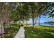 Picturesque community park with shaded benches, trees, and water views at 3010 59Th S St # 314, Gulfport, FL 33707