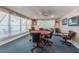 A game room with round table, chairs, ceiling fan, and natural light from a large window at 3010 59Th S St # 314, Gulfport, FL 33707
