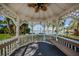 A cozy gazebo with bench seating showcasing views of a community dock with grassy areas at 3010 59Th S St # 314, Gulfport, FL 33707
