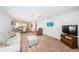 Bright living room featuring neutral decor, cozy seating, and a seamless flow into the dining area at 3010 59Th S St # 314, Gulfport, FL 33707