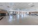 Community room with a large dance floor, tables, chairs, and stage area at 3010 59Th S St # 314, Gulfport, FL 33707