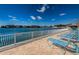 Waterfront deck with lounge chairs, overlooking the bay and neighboring houses at 3010 59Th S St # 314, Gulfport, FL 33707