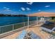 Private waterfront deck with comfortable lounge chairs and canopy at 3010 59Th S St # 314, Gulfport, FL 33707