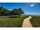 Sidewalk through the waterfront park offering benches and picnic tables with beautiful water views at 3010 59Th S St # 314, Gulfport, FL 33707