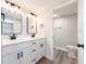 Beautiful bathroom features dual sinks, modern fixtures, and a separate toilet room at 3021 Countryside Blvd # 23A, Clearwater, FL 33761