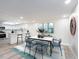 Cozy dining area open to the kitchen, featuring stylish seating and modern decor at 3021 Countryside Blvd # 23A, Clearwater, FL 33761