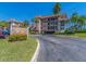 Beautiful Brynnwood community building featuring mature landscaping and a private entry drive at 3021 Countryside Blvd # 23A, Clearwater, FL 33761