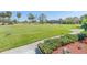 Beautiful golf course view with lush green grass and manicured landscape at 3021 Countryside Blvd # 23A, Clearwater, FL 33761