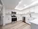 Well-lit kitchen showcasing stainless steel appliances, white cabinetry, and modern finishes at 3021 Countryside Blvd # 23A, Clearwater, FL 33761