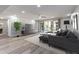Bright living room with recessed lighting, sleek flooring, and access to a private balcony at 3021 Countryside Blvd # 23A, Clearwater, FL 33761