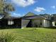 Spacious backyard with a screened-in patio, perfect for outdoor activities and relaxation at 3207 Sunwatch Dr, Wesley Chapel, FL 33544