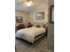Cozy bedroom features a neutral color palette, ceiling fan, and inviting decor, creating a relaxing atmosphere at 3207 Sunwatch Dr, Wesley Chapel, FL 33544