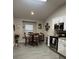Bright kitchen featuring stainless steel appliances, a dining area, and modern finishes at 3207 Sunwatch Dr, Wesley Chapel, FL 33544
