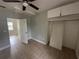 A bedroom featuring tile floors, ceiling fan, and closet space at 3441 15Th S Ave, St Petersburg, FL 33711