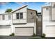 New construction townhome with modern architectural style, neutral color palette, and an attached two-car garage at 3475 Timber Crossing Ave, Brandon, FL 33511