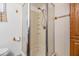 Bathroom showcasing a walk-in shower, white tile, and neutral accents at 37246 Eileen Ave, Zephyrhills, FL 33542