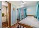 Comfortable bedroom with wood-look floors and access to an attached bathroom at 37246 Eileen Ave, Zephyrhills, FL 33542