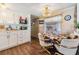 Cozy dining area features a round table, chandelier, and wood-look flooring at 37246 Eileen Ave, Zephyrhills, FL 33542