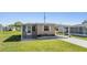Single story home featuring covered parking and landscaped yard at 37246 Eileen Ave, Zephyrhills, FL 33542