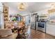 Open concept kitchen featuring stainless steel appliances and wood-look flooring at 37246 Eileen Ave, Zephyrhills, FL 33542