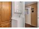 Convenient laundry area with stackable washer and dryer, adjacent to wood cabinets at 37246 Eileen Ave, Zephyrhills, FL 33542