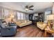 Comfortable living area with wood-look flooring, TV, and cozy seating at 37246 Eileen Ave, Zephyrhills, FL 33542