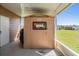 Exterior view of shed for storage, complemented by a covered patio area; practical outdoor space at 37246 Eileen Ave, Zephyrhills, FL 33542